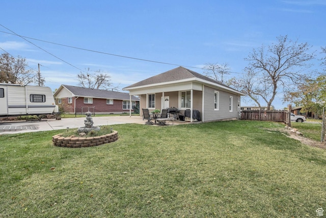 410 N 175 E, North Salt Lake, UT 84054 - exterior space featuring fence, roof with shingles, a patio area, and a lawn