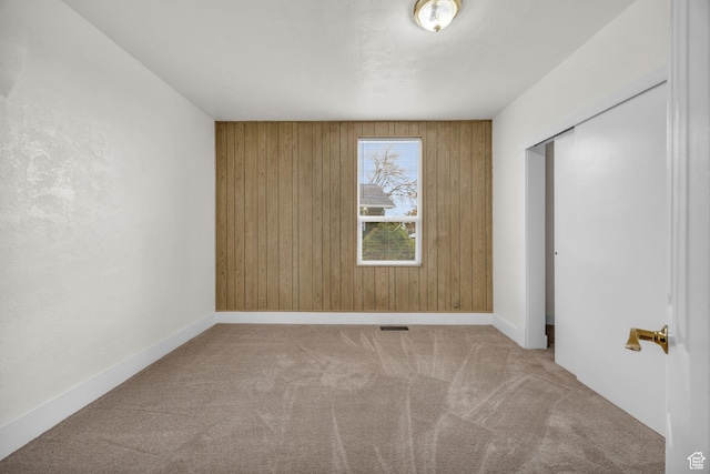 410 N 175 E, North Salt Lake, UT 84054 - unfurnished bedroom with carpet flooring, a closet, wood walls, and baseboards