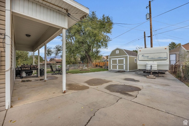 410 N 175 E, North Salt Lake, UT 84054 - view of patio / terrace featuring a fenced backyard, an outbuilding, and a storage shed