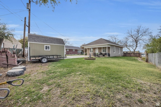 410 N 175 E, North Salt Lake, UT 84054 - view of yard featuring an outbuilding, a fenced backyard, and a shed