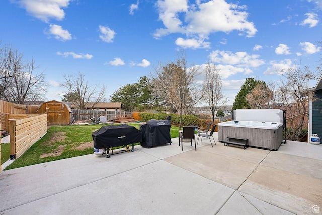 1567 Heather Dr, Layton, UT 84040 - view of patio / terrace with a hot tub, a grill, and a fenced backyard