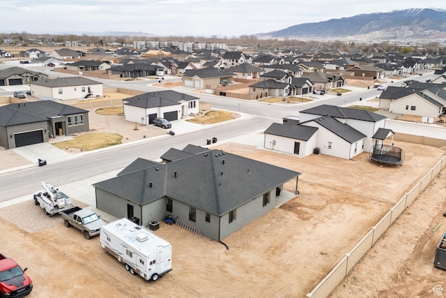 bird's eye view featuring a residential view and a mountain view