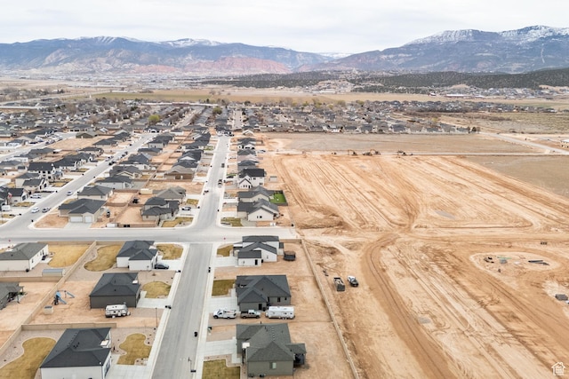 drone / aerial view featuring a residential view and a mountain view