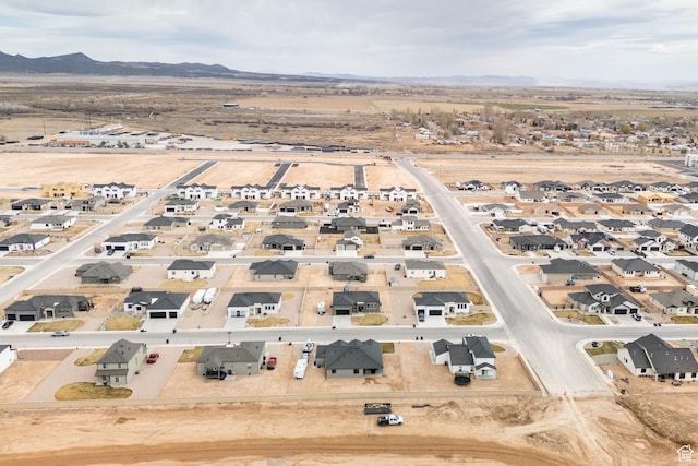 birds eye view of property with a residential view and a mountain view