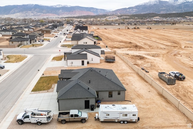 bird's eye view with a residential view and a mountain view