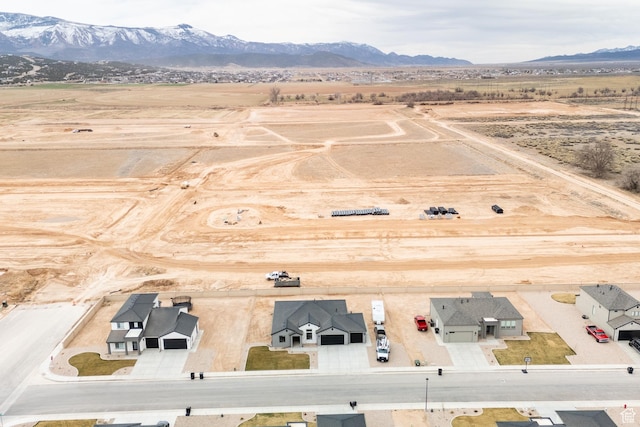 birds eye view of property with a mountain view