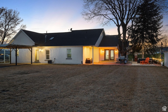 682 N 700 E, Lehi, UT 84043 - back of property at dusk with a patio, central air condition unit, a lawn, and a pergola
