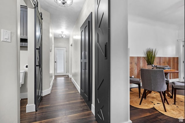 682 N 700 E, Lehi, UT 84043 - hallway featuring baseboards, a barn door, and dark wood-type flooring