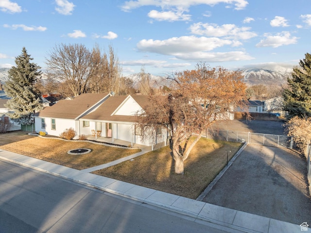 682 N 700 E, Lehi, UT 84043 - ranch-style home with a gate, fence, a front lawn, stucco siding, and a mountain view