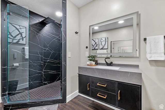 682 N 700 E, Lehi, UT 84043 - bathroom featuring a marble finish shower, baseboards, wood finished floors, and vanity