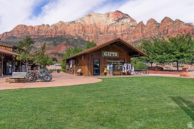 35 Lion Blvd, Springdale, UT 84767 - back of property featuring a lawn and a mountain view