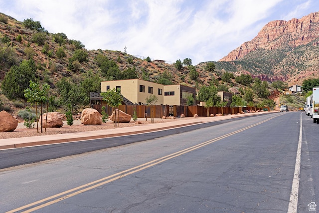35 Lion Blvd, Springdale, UT 84767 - view of street with curbs, a mountain view, and sidewalks