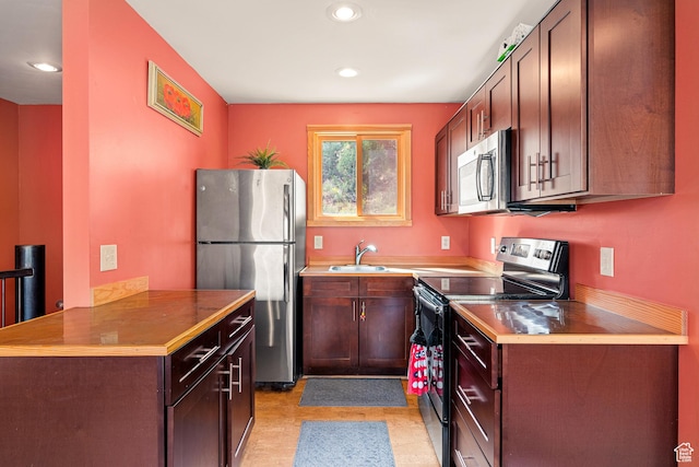 35 Lion Blvd, Springdale, UT 84767 - kitchen with a sink, appliances with stainless steel finishes, recessed lighting, and light floors