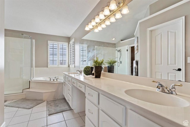 bathroom featuring vaulted ceiling, a sink, a stall shower, and tile patterned flooring