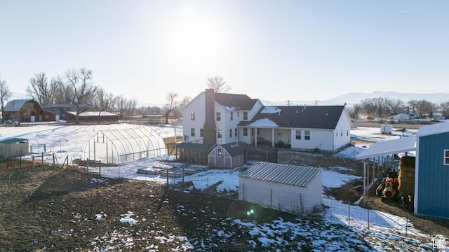 1009 E High Creek Rd, Cove, UT 84320 - snowy yard featuring a mountain view