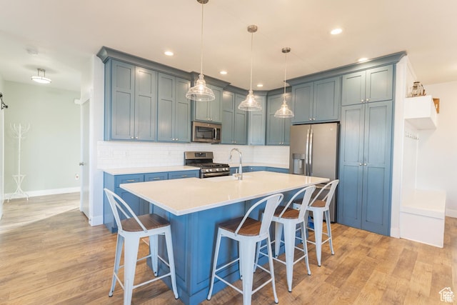 1009 E High Creek Rd, Cove, UT 84320 - kitchen with stainless steel appliances, baseboards, light countertops, tasteful backsplash, and recessed lighting