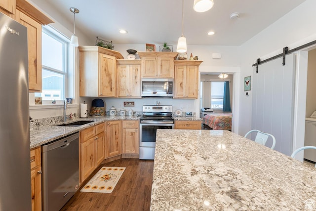 1009 E High Creek Rd, Cove, UT 84320 - kitchen featuring appliances with stainless steel finishes, a sink, light brown cabinetry, plenty of natural light, and recessed lighting