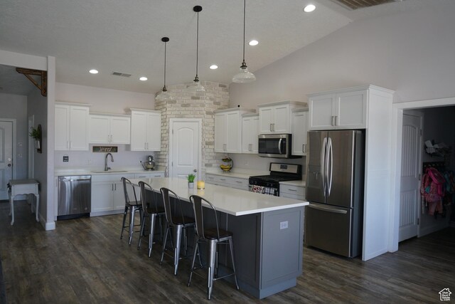 160 S 550 E Unit 18, Enterprise, UT 84725 - kitchen featuring white cabinetry, a sink, a center island, and appliances with stainless steel finishes