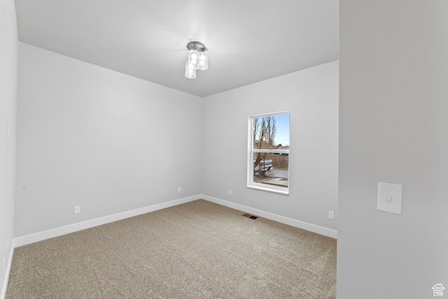 245 E Tidwell Ave Unit 5, Green River, UT 84525 - carpeted spare room featuring visible vents and baseboards