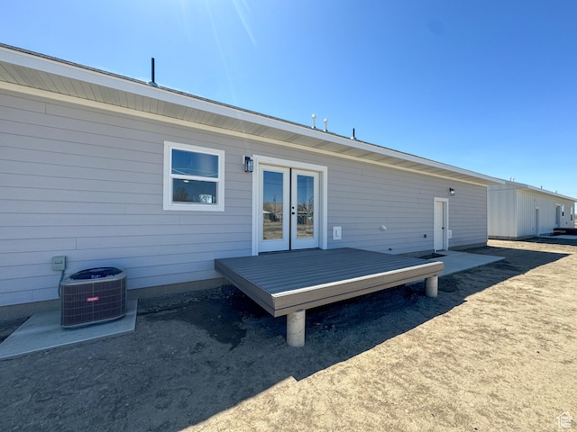 245 E Tidwell Ave Unit 5, Green River, UT 84525 - back of house featuring a deck, french doors, and central AC