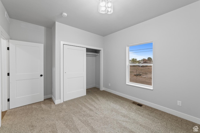 245 E Tidwell Ave Unit 5, Green River, UT 84525 - unfurnished bedroom with visible vents, baseboards, a closet, and carpet floors
