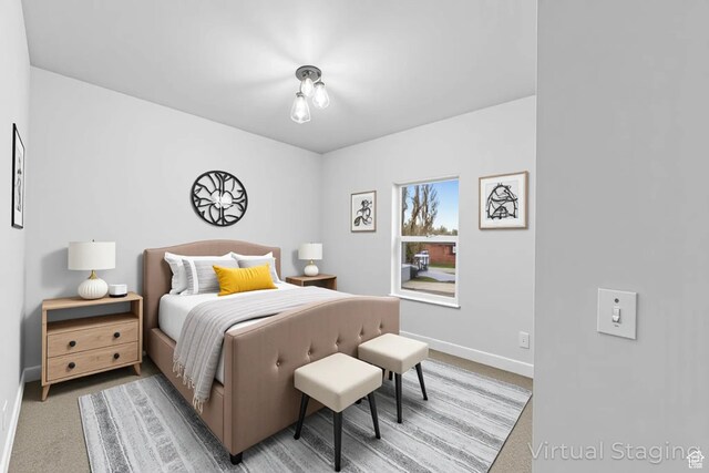 245 E Tidwell Ave Unit 5, Green River, UT 84525 - bedroom featuring baseboards and light carpet