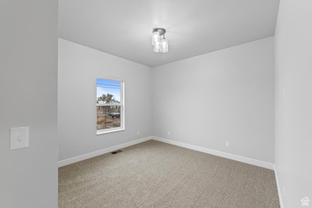 245 E Tidwell Ave Unit 5, Green River, UT 84525 - carpeted empty room with baseboards and visible vents