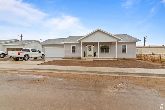 245 E Tidwell Ave Unit 5, Green River, UT 84525 - view of front of house featuring a garage, a shingled roof, crawl space, and concrete driveway