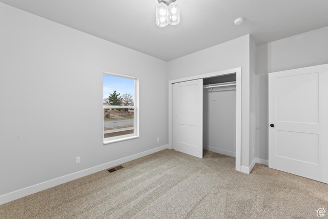 245 E Tidwell Ave Unit 5, Green River, UT 84525 - unfurnished bedroom featuring a closet, carpet, visible vents, and baseboards