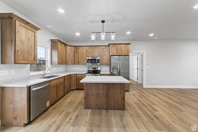245 E Tidwell Ave Unit 5, Green River, UT 84525 - kitchen with a center island, light wood finished floors, a sink, and stainless steel appliances