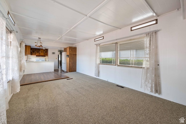 102 N 3910 W, Hurricane, UT 84737 - unfurnished living room featuring an inviting chandelier, carpet, and visible vents