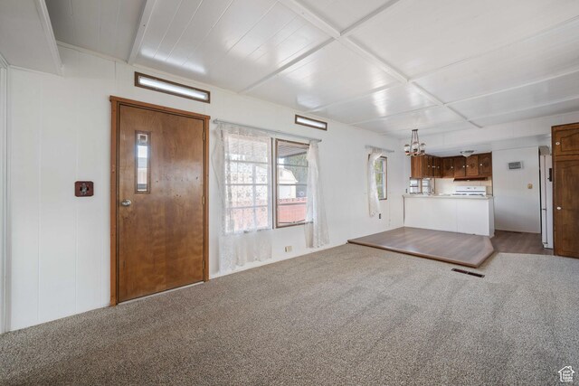 102 N 3910 W, Hurricane, UT 84737 - unfurnished living room with visible vents, carpet flooring, and an inviting chandelier