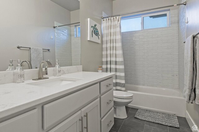 full bathroom featuring toilet, tile patterned flooring, vanity, and shower / bath combo
