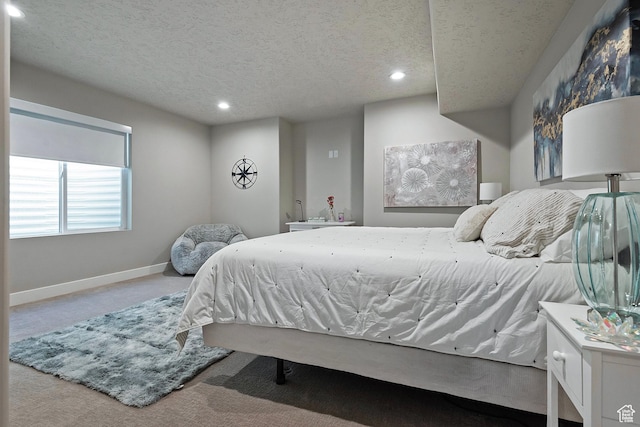 bedroom with carpet flooring, a textured ceiling, baseboards, and recessed lighting