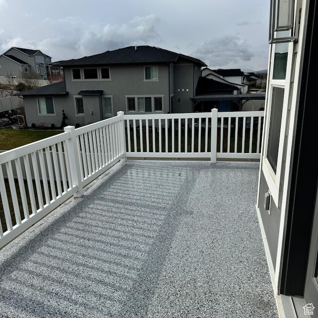 wooden terrace with a residential view