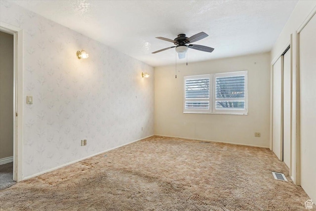 7342 S Promenade Cir E, Cottonwood Heights, UT 84121 - unfurnished bedroom with carpet flooring, a textured ceiling, visible vents, and wallpapered walls