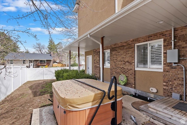 7342 S Promenade Cir E, Cottonwood Heights, UT 84121 - view of patio / terrace with fence and a hot tub