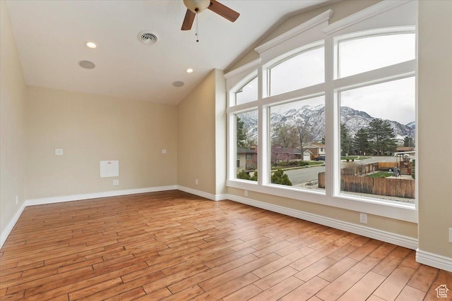 7342 S Promenade Cir E, Cottonwood Heights, UT 84121 - unfurnished room featuring a wealth of natural light, visible vents, ceiling fan, and a mountain view