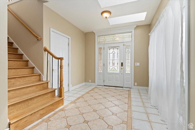 7342 S Promenade Cir E, Cottonwood Heights, UT 84121 - foyer with baseboards, a skylight, stairway, and light tile patterned floors