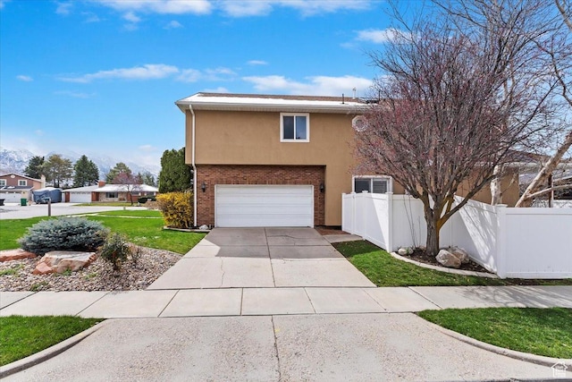 7342 S Promenade Cir E, Cottonwood Heights, UT 84121 - view of front of house featuring fence, an attached garage, concrete driveway, a front yard, and stucco siding