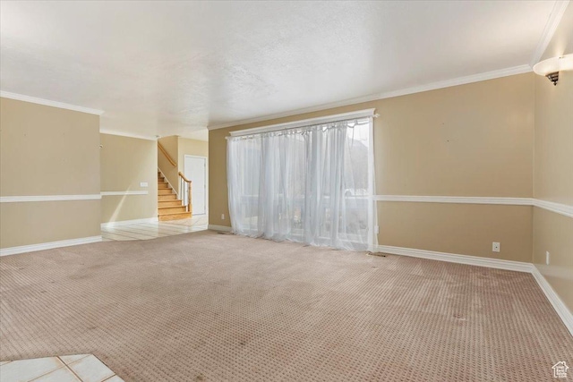 7342 S Promenade Cir E, Cottonwood Heights, UT 84121 - unfurnished living room featuring baseboards, crown molding, stairs, and carpet
