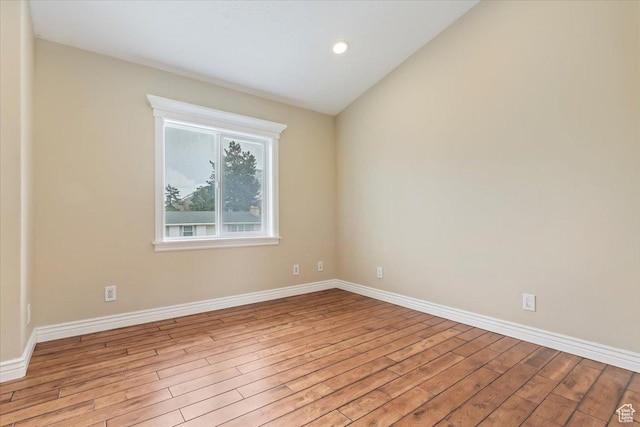 7342 S Promenade Cir E, Cottonwood Heights, UT 84121 - empty room featuring recessed lighting, baseboards, lofted ceiling, and wood finished floors