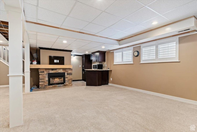 7342 S Promenade Cir E, Cottonwood Heights, UT 84121 - living room featuring baseboards, visible vents, a stone fireplace, and light colored carpet