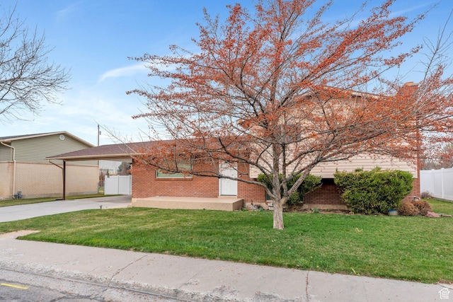 975 N 200 E, Lehi, UT 84043 - view of front of property featuring driveway, a carport, fence, and brick siding