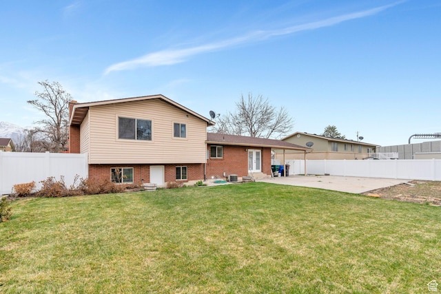 975 N 200 E, Lehi, UT 84043 - back of house with brick siding, fence private yard, a yard, and a patio area