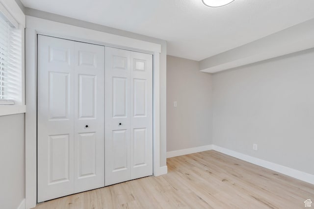 975 N 200 E, Lehi, UT 84043 - unfurnished bedroom with baseboards, light wood-style flooring, and a closet