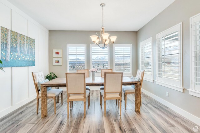 680 S Appenzell Ln, Midway, UT 84049 - dining space with light wood finished floors, baseboards, and a chandelier