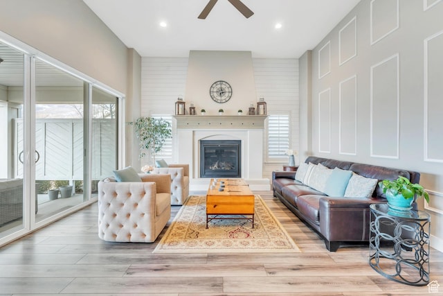 680 S Appenzell Ln, Midway, UT 84049 - living area with wood finished floors, recessed lighting, a glass covered fireplace, and ceiling fan