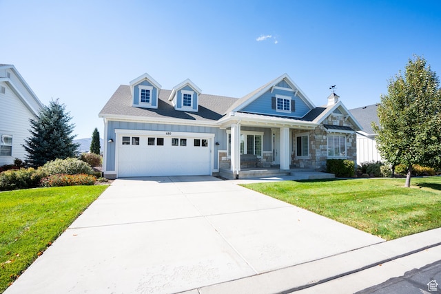 680 S Appenzell Ln, Midway, UT 84049 - view of front facade with driveway, a front yard, covered porch, and an attached garage