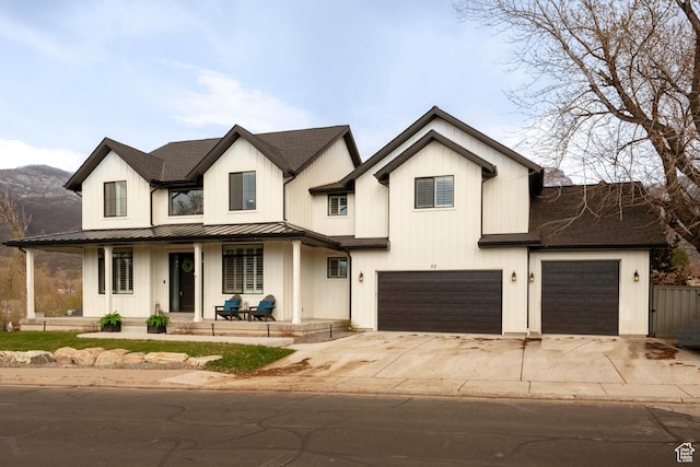 52 N 400 W, Farmington, UT 84025 - modern inspired farmhouse with concrete driveway, board and batten siding, an attached garage, a porch, and a standing seam roof